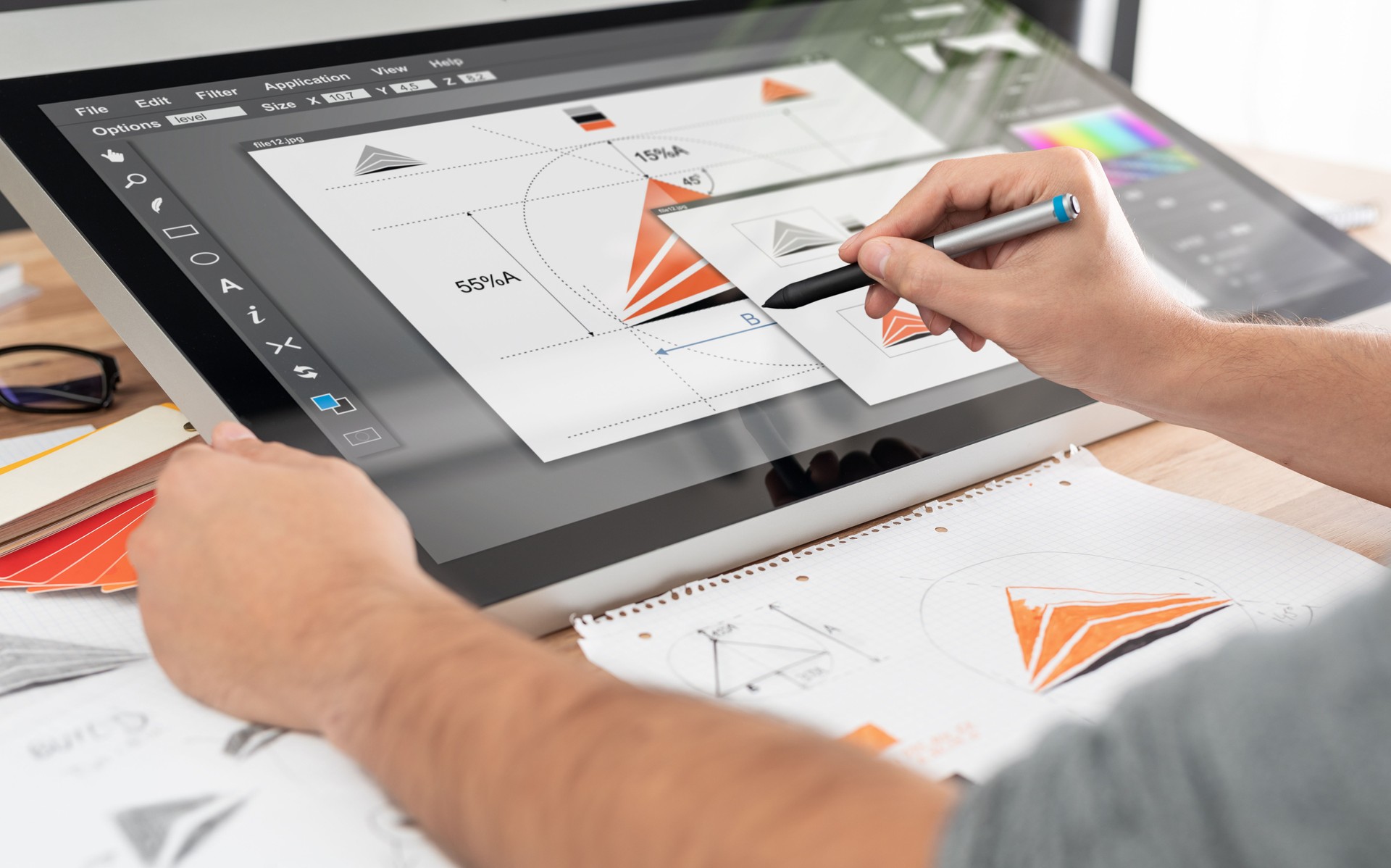 Graphic designer drawing sketches logo design.